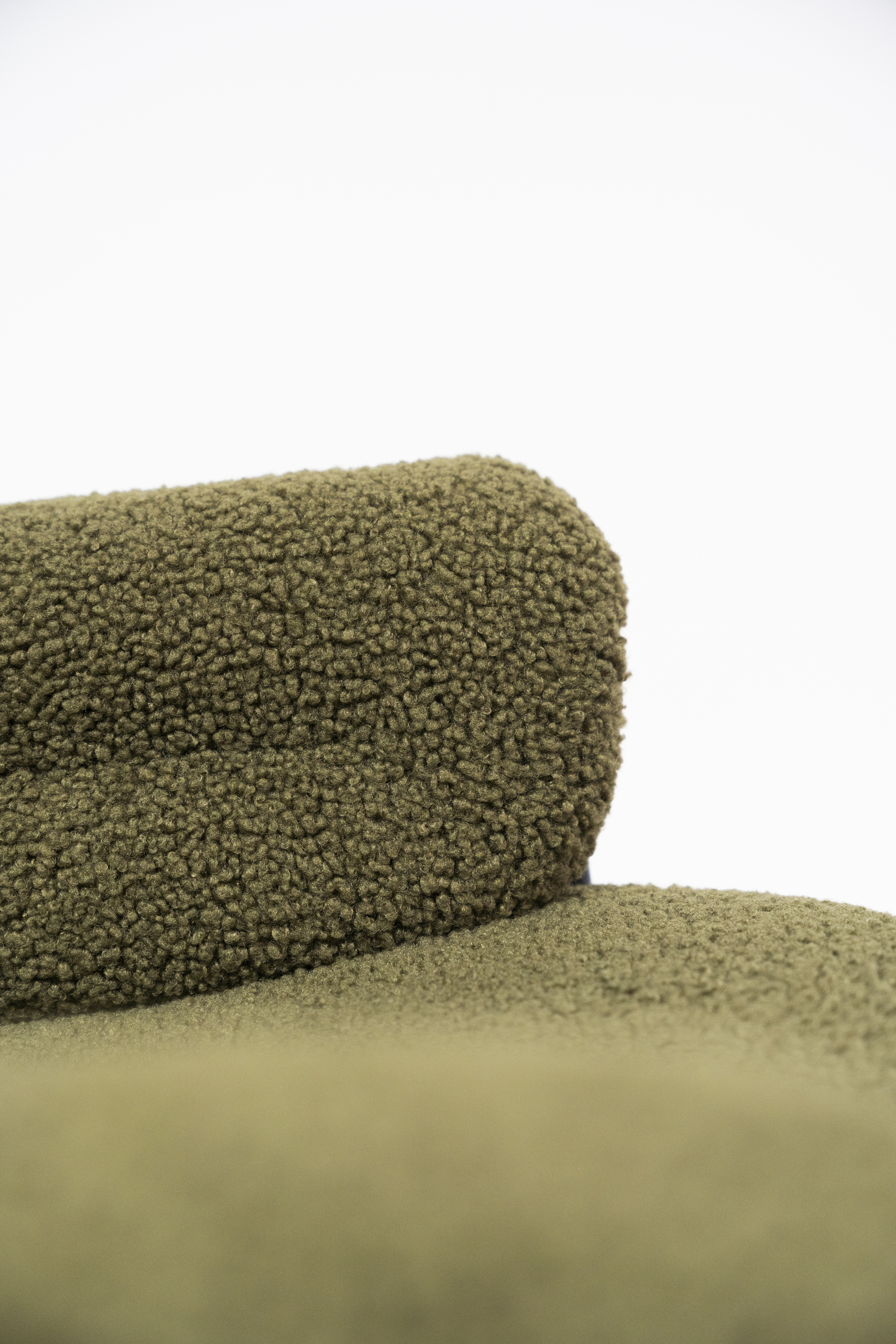 Close up detail of a high-end white boucle fabric sofa